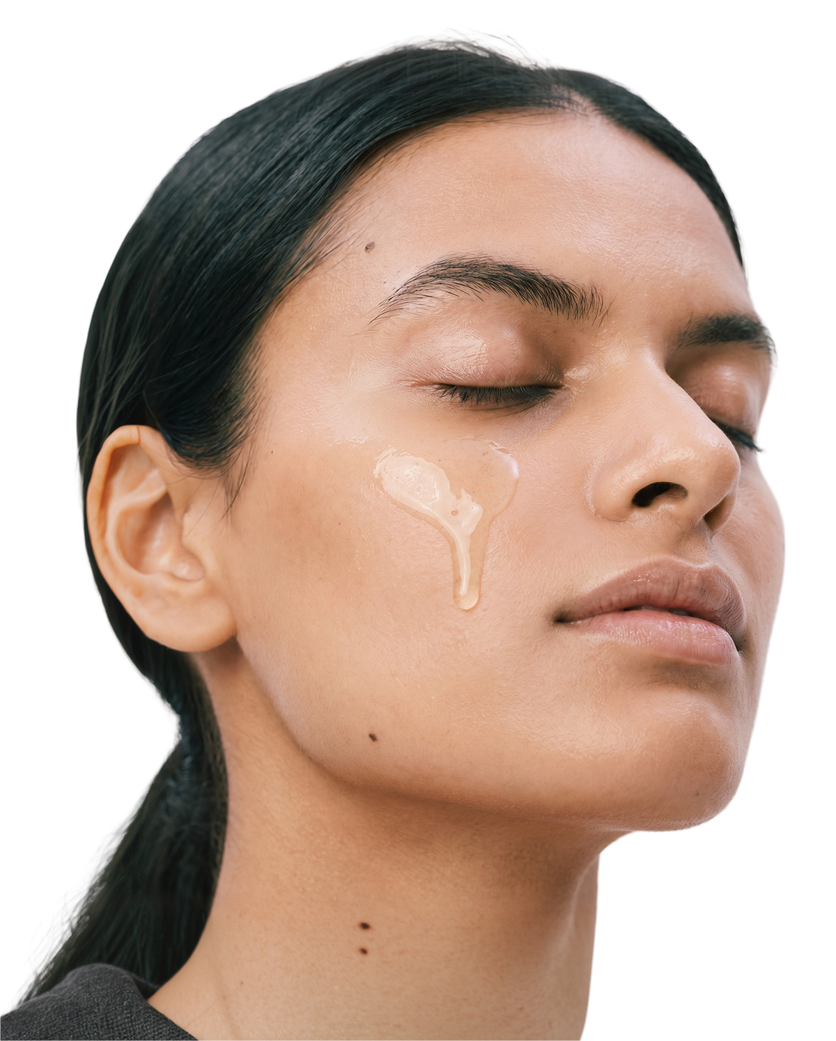Woman applying collagen balancing cleanser